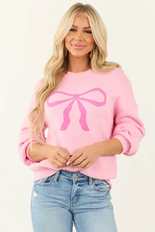Bright Carnation Bow Graphic Puff Sleeve Sweater sold by Lime Lush