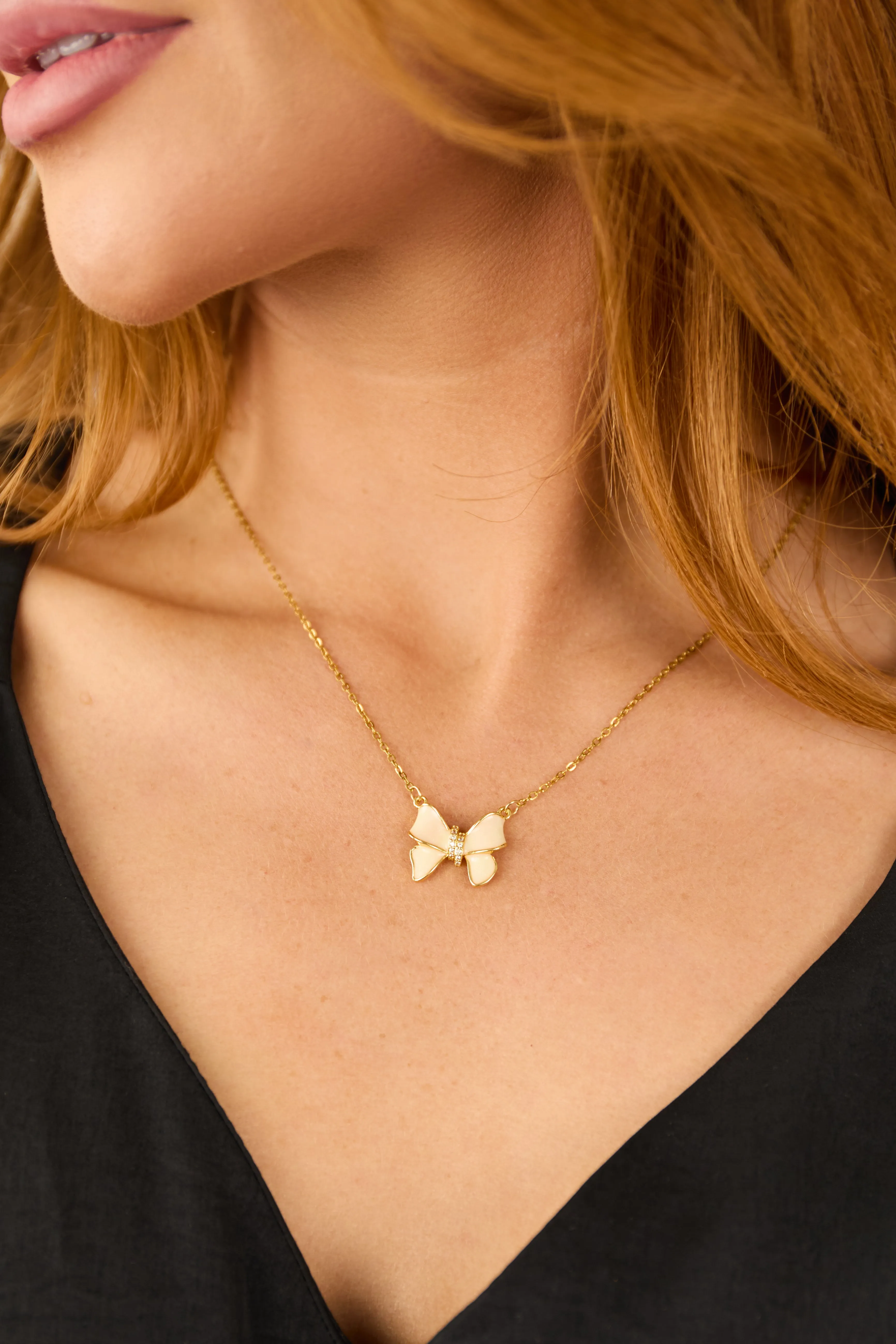 Gold and Ivory Glittery Bow Necklace sold by Lime Lush