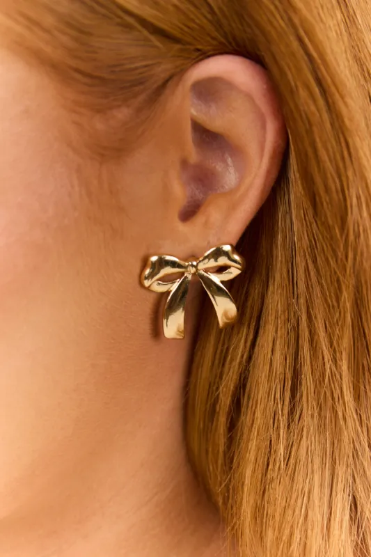Gold Metallic Large Polished Bow Stud Earrings sold by Lime Lush