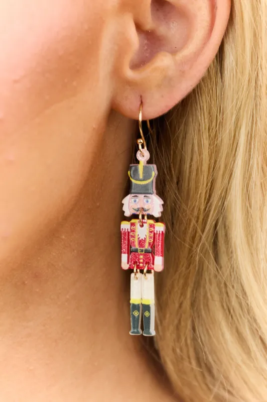 Ruby Acrylic Nutcracker Dangle Earrings sold by Lime Lush