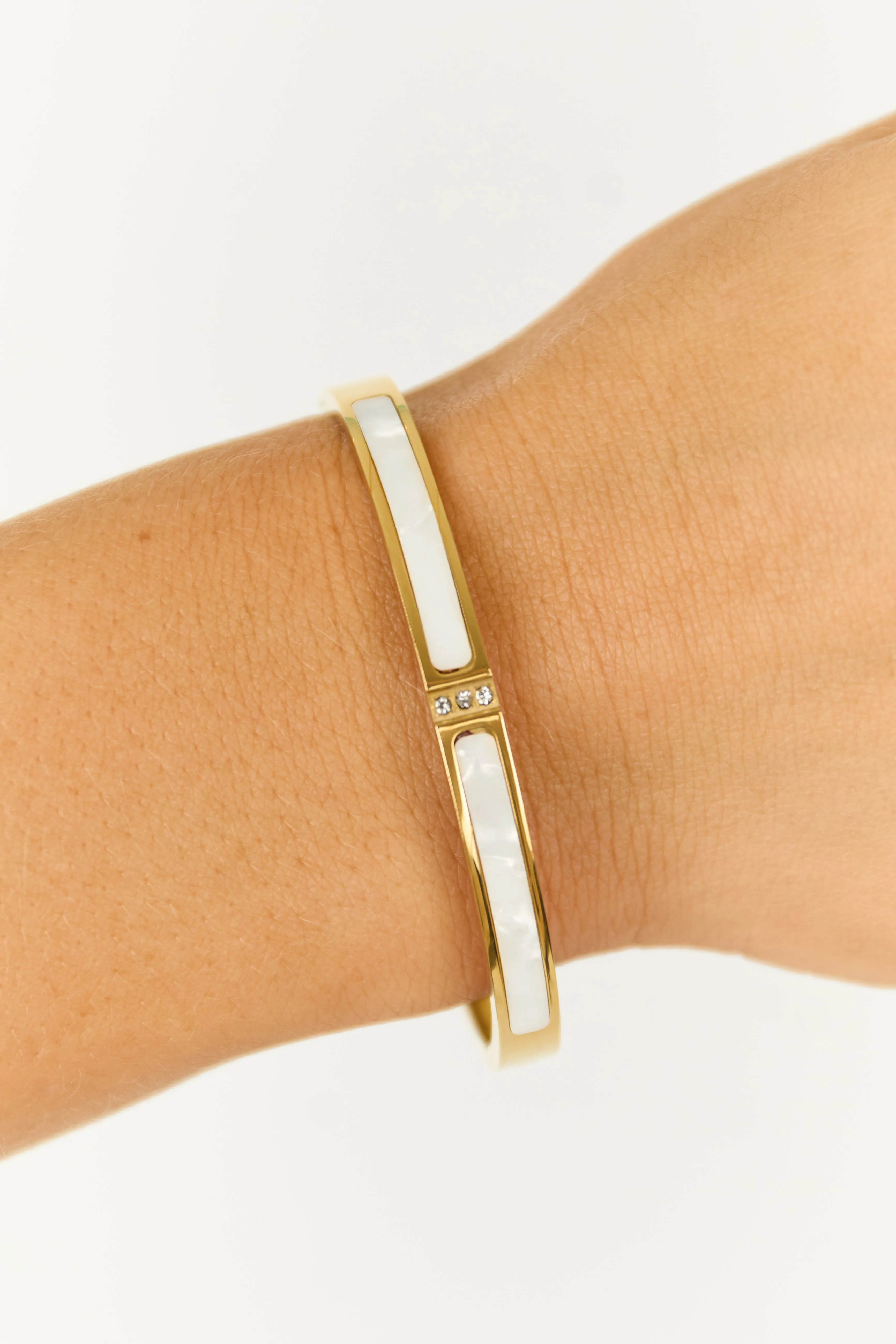 Gold Hinge Bangle Bracelet with Pearl White Stones sold by Lime Lush