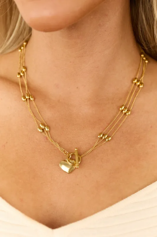 Gold Multi Strand Heart Pendant Toggle Necklace sold by Lime Lush
