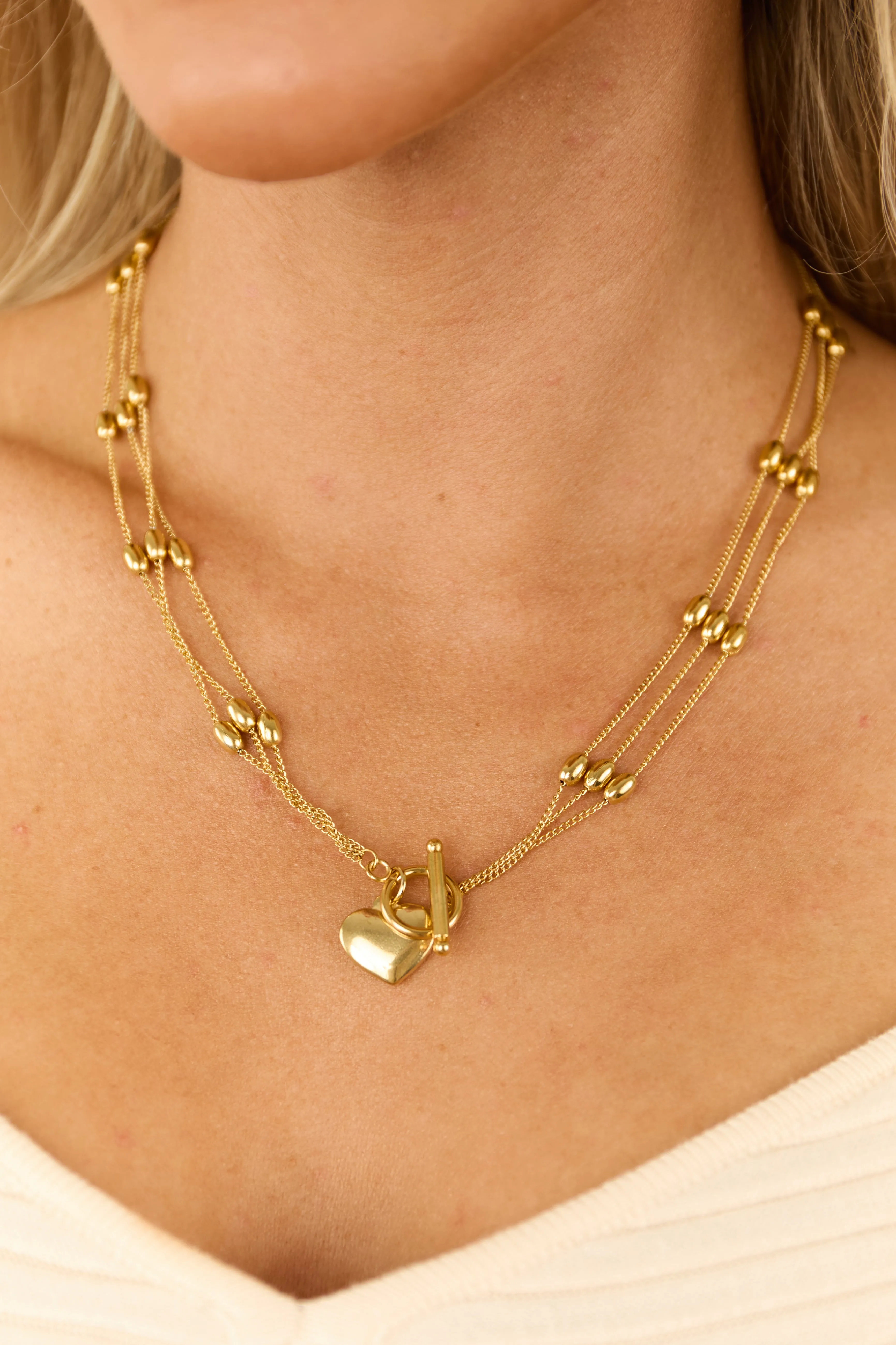 Gold Multi Strand Heart Pendant Toggle Necklace sold by Lime Lush