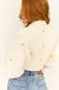 Cream Rosette Detail Bolero Shrug Cardigan sold by Lime Lush