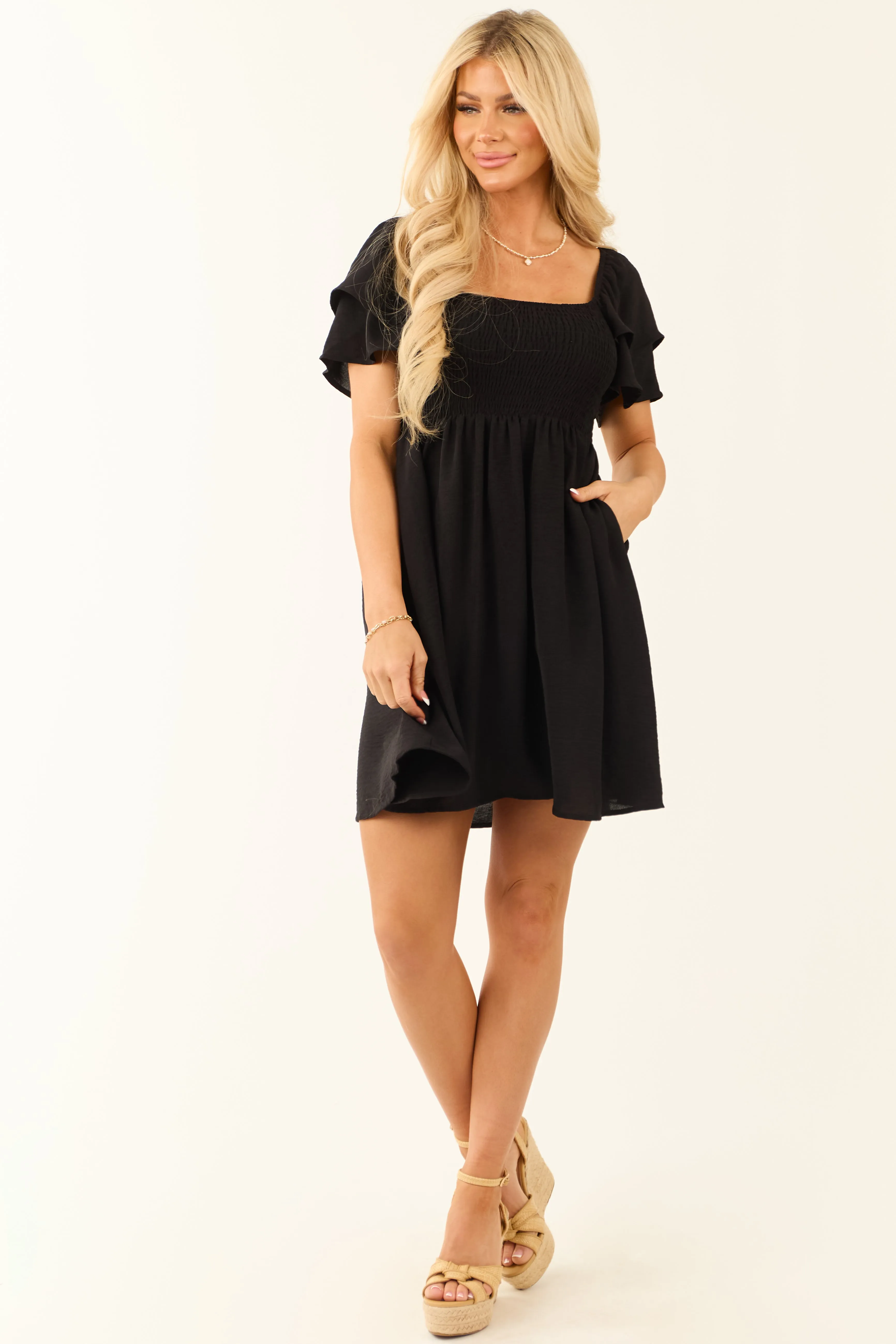 Black Short Ruffle Sleeve Smocked Mini Dress sold by Lime Lush product image thumbnail 2