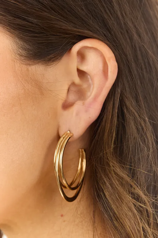 Gold Metallic Oval Dimensional Hoop Earrings sold by Lime Lush