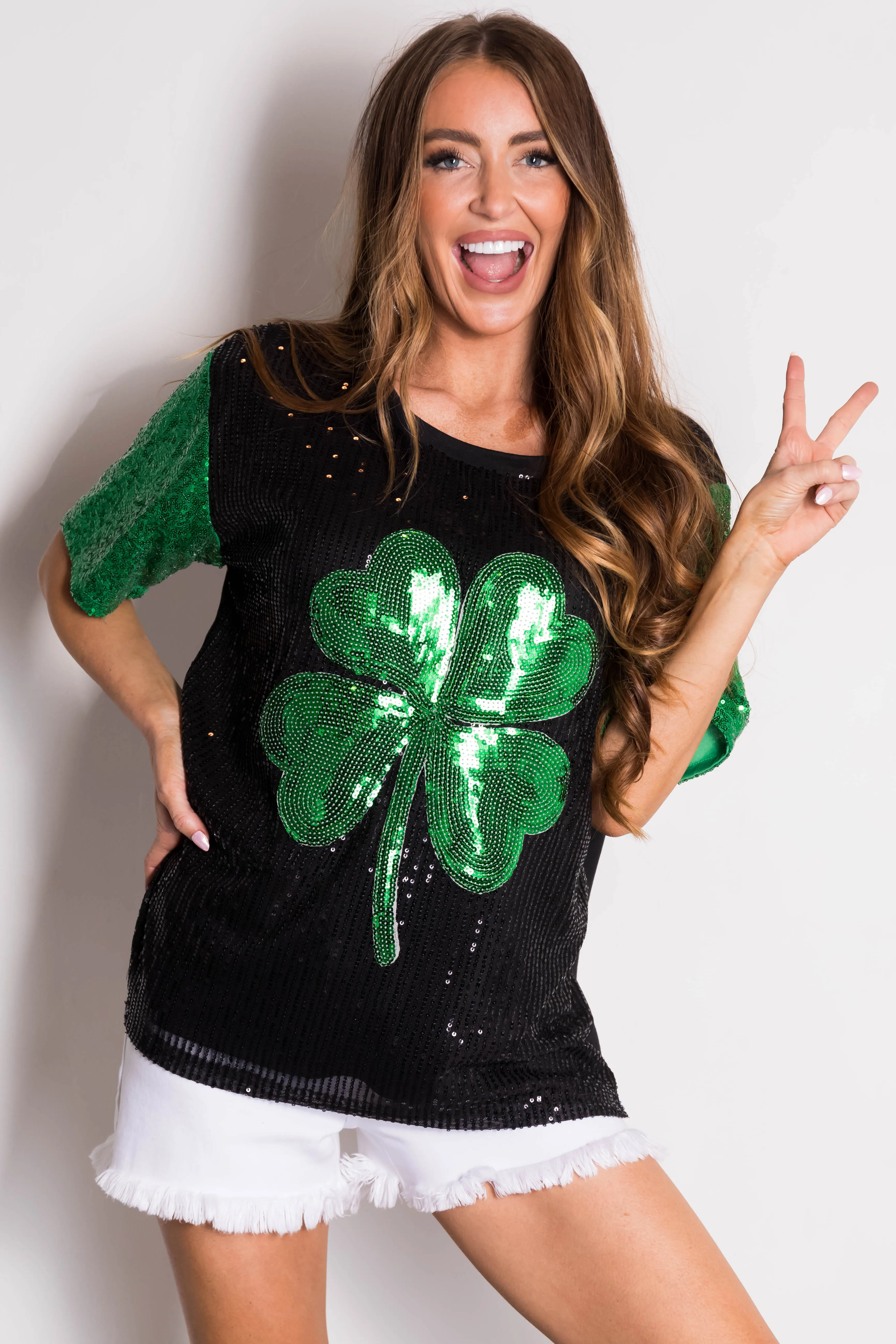 Black Sequined Clover Graphic Half Sleeve Top sold by Lime Lush