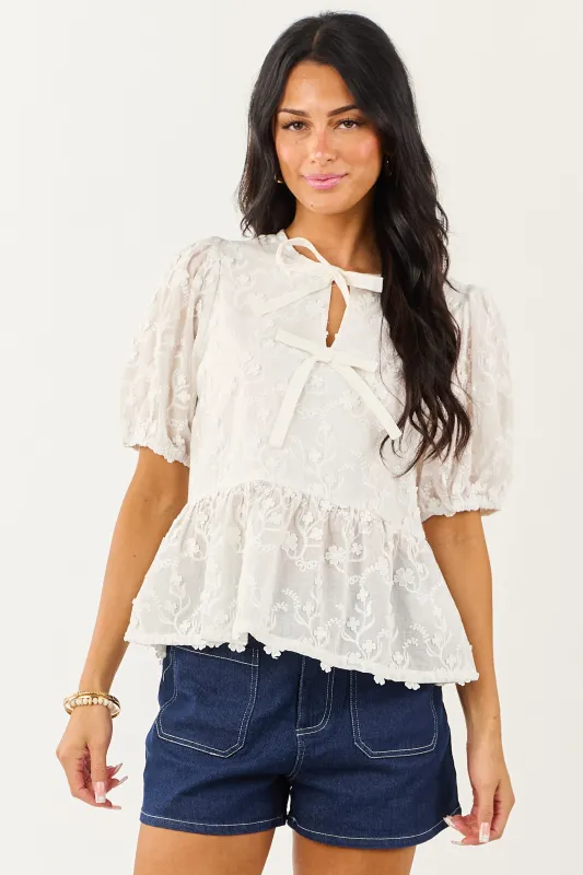 Off White Textured Floral Short Sleeve Peplum Blouse sold by Lime Lush