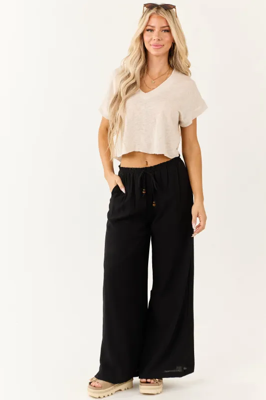 Black Wide Leg Drawstring High Waist Pants sold by Lime Lush