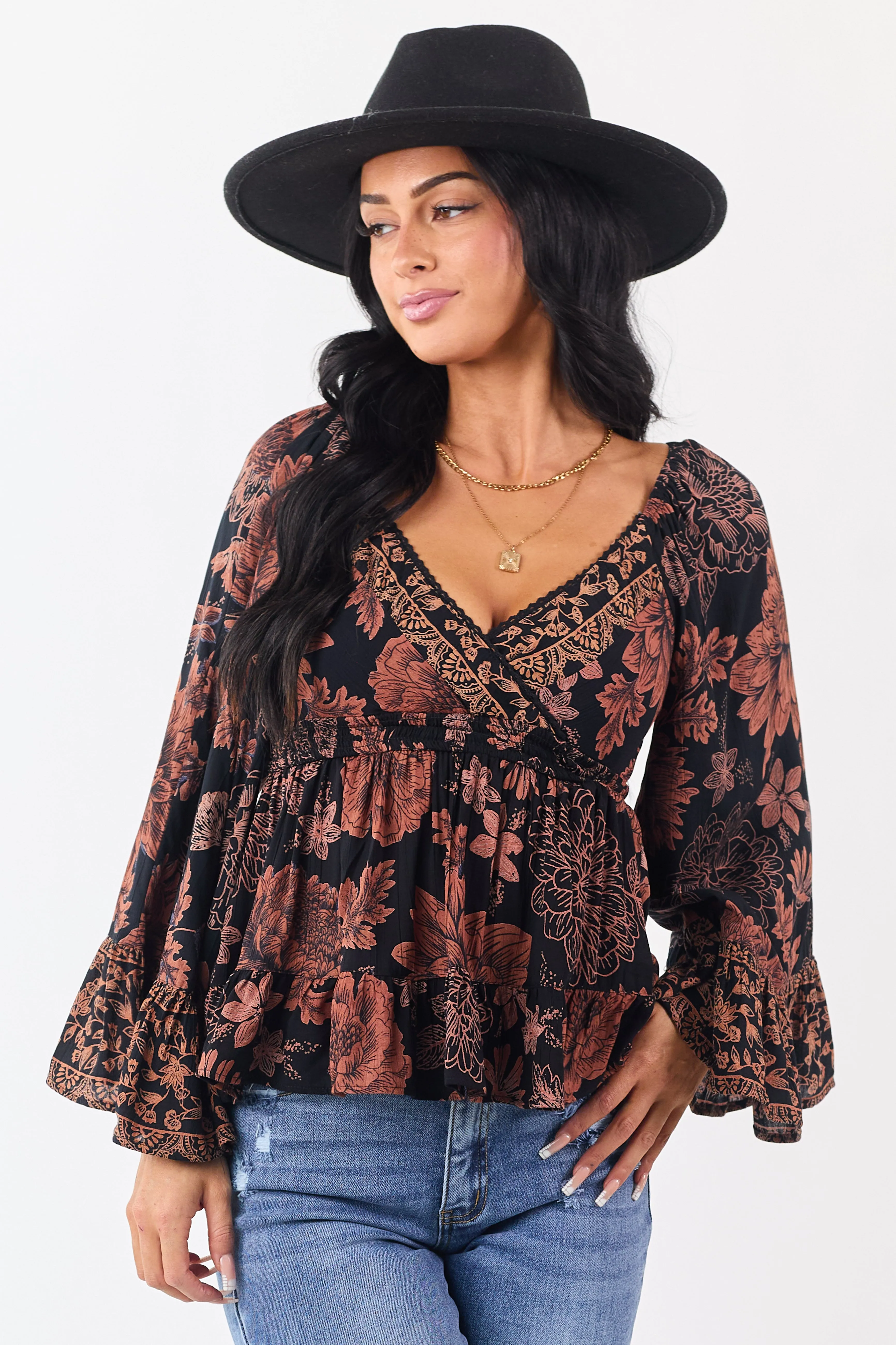 Black Floral Print Flare Sleeve Smocked Waist Top sold by Lime Lush