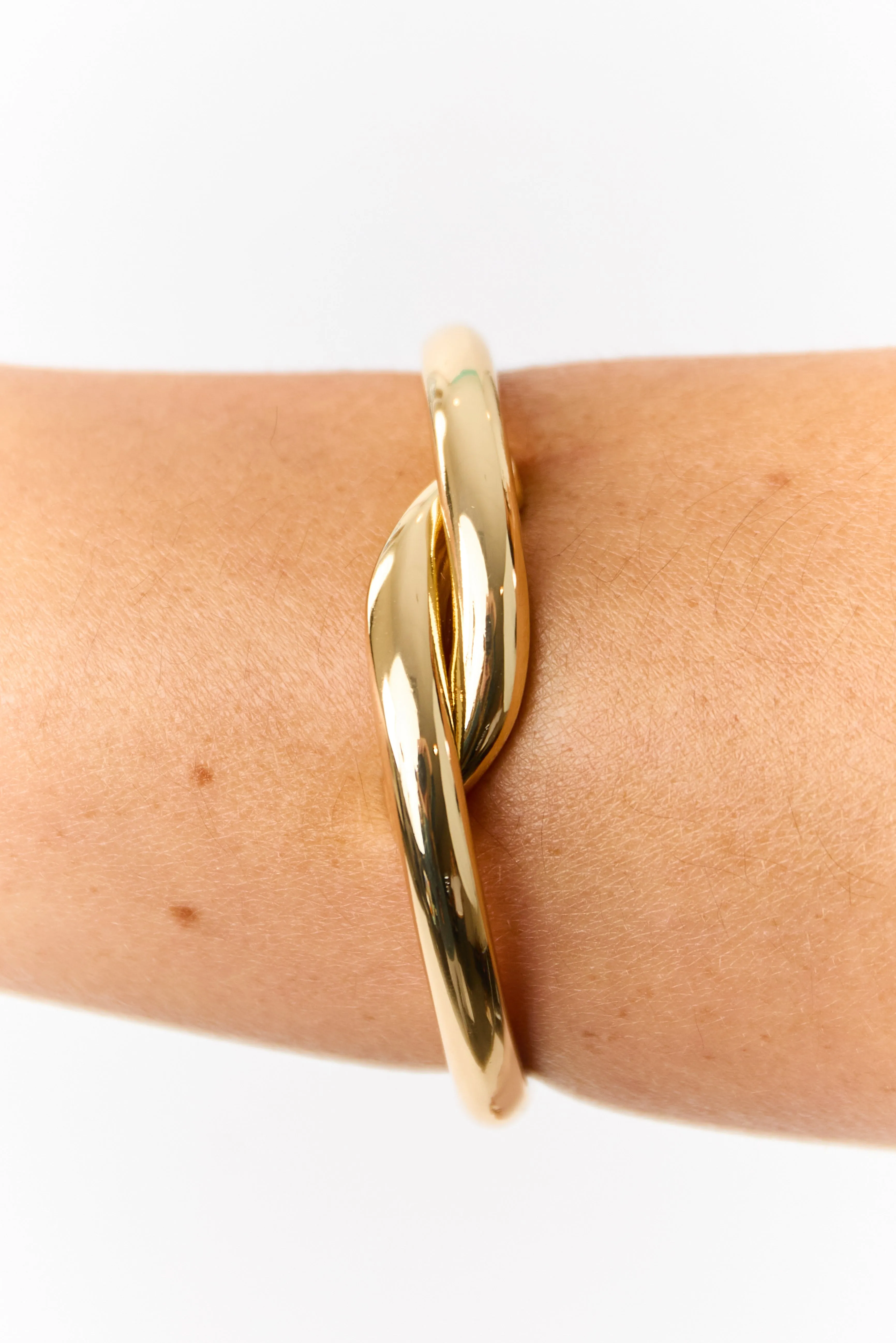 Gold Metallic Twist Clasp Bangle Bracelet sold by Lime Lush