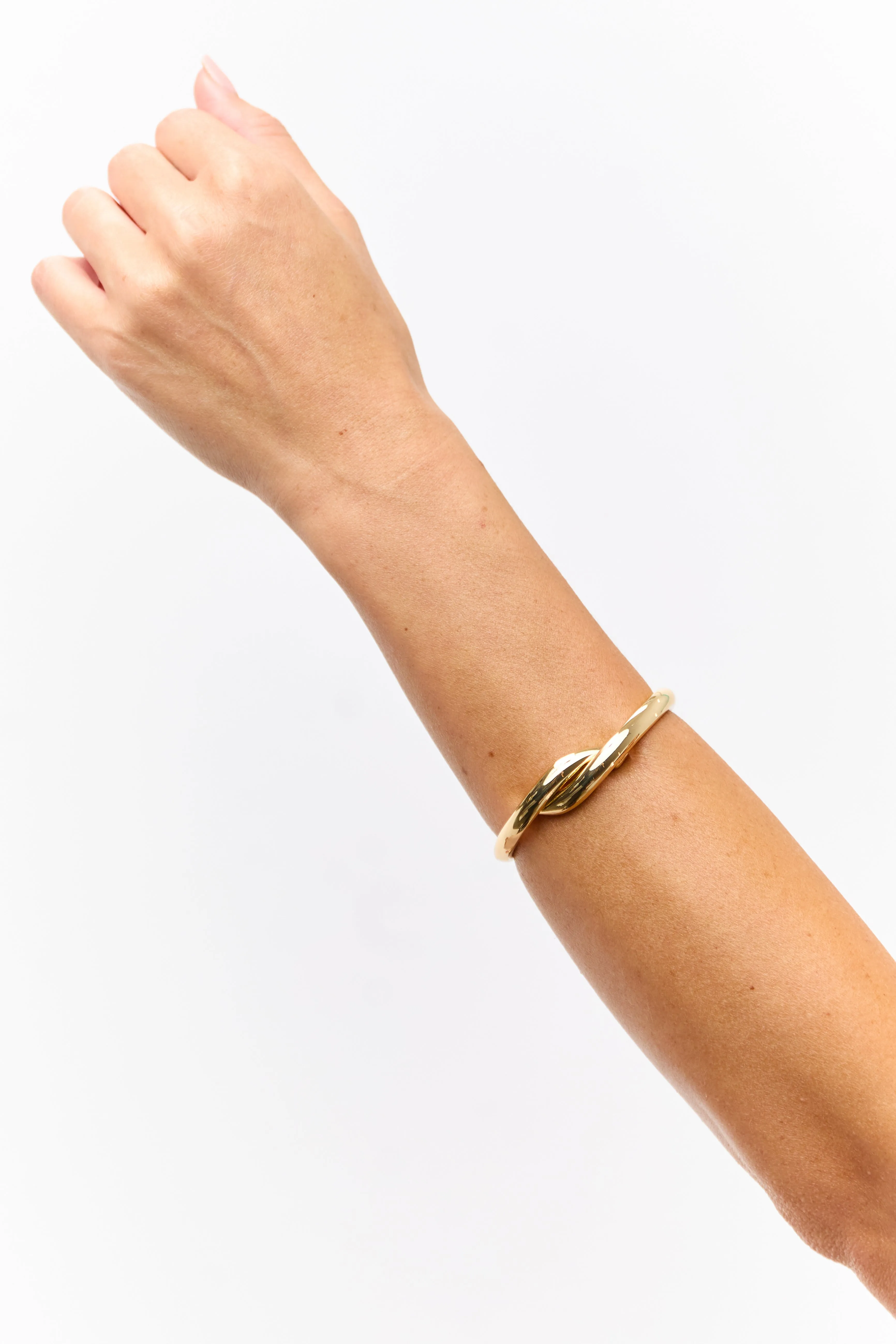 Gold Metallic Twist Clasp Bangle Bracelet sold by Lime Lush product image thumbnail 2