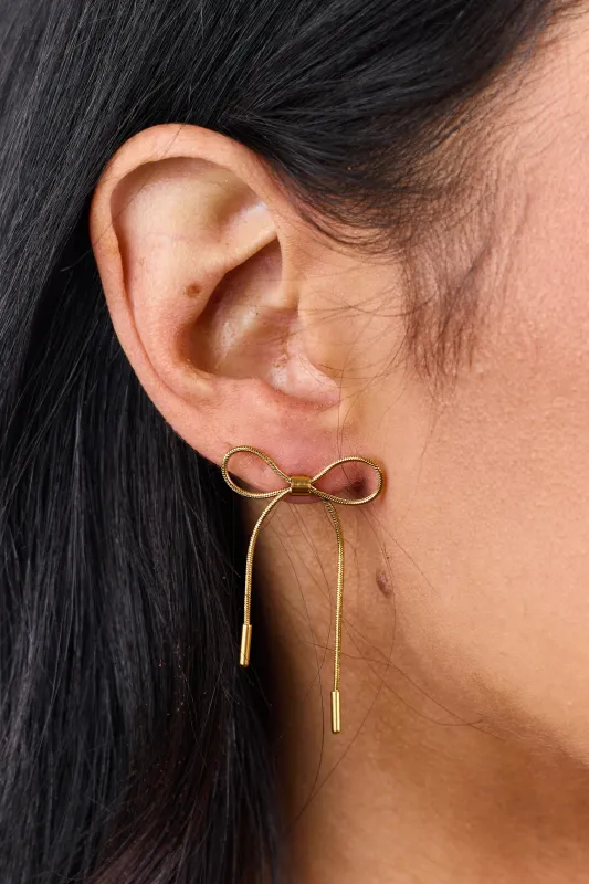 Gold Metallic Stainless Steel Bow Dangle Earrings sold by Lime Lush