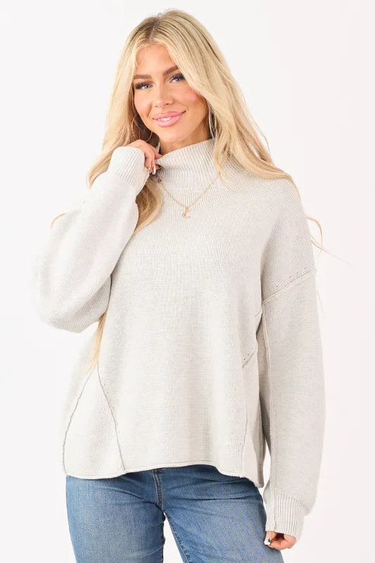 Cloud Grey Mock Neck Exposed Seam Knit Sweater sold by Lime Lush