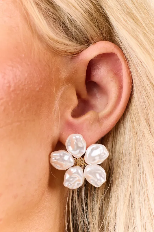Ivory Wavy Pearl Flower Stud Earrings sold by Lime Lush