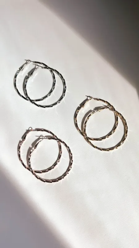 Metallic Twisted Hoop Earrings Set of 3 sold by Lime Lush