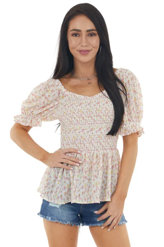 Ivory Ditsy Floral Print Smocked Textured Woven Blouse sold by Lime Lush