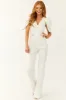 White Denim Jumpsuit with Shell Sleeves sold by Lime Lush