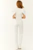White Denim Jumpsuit with Shell Sleeves sold by Lime Lush