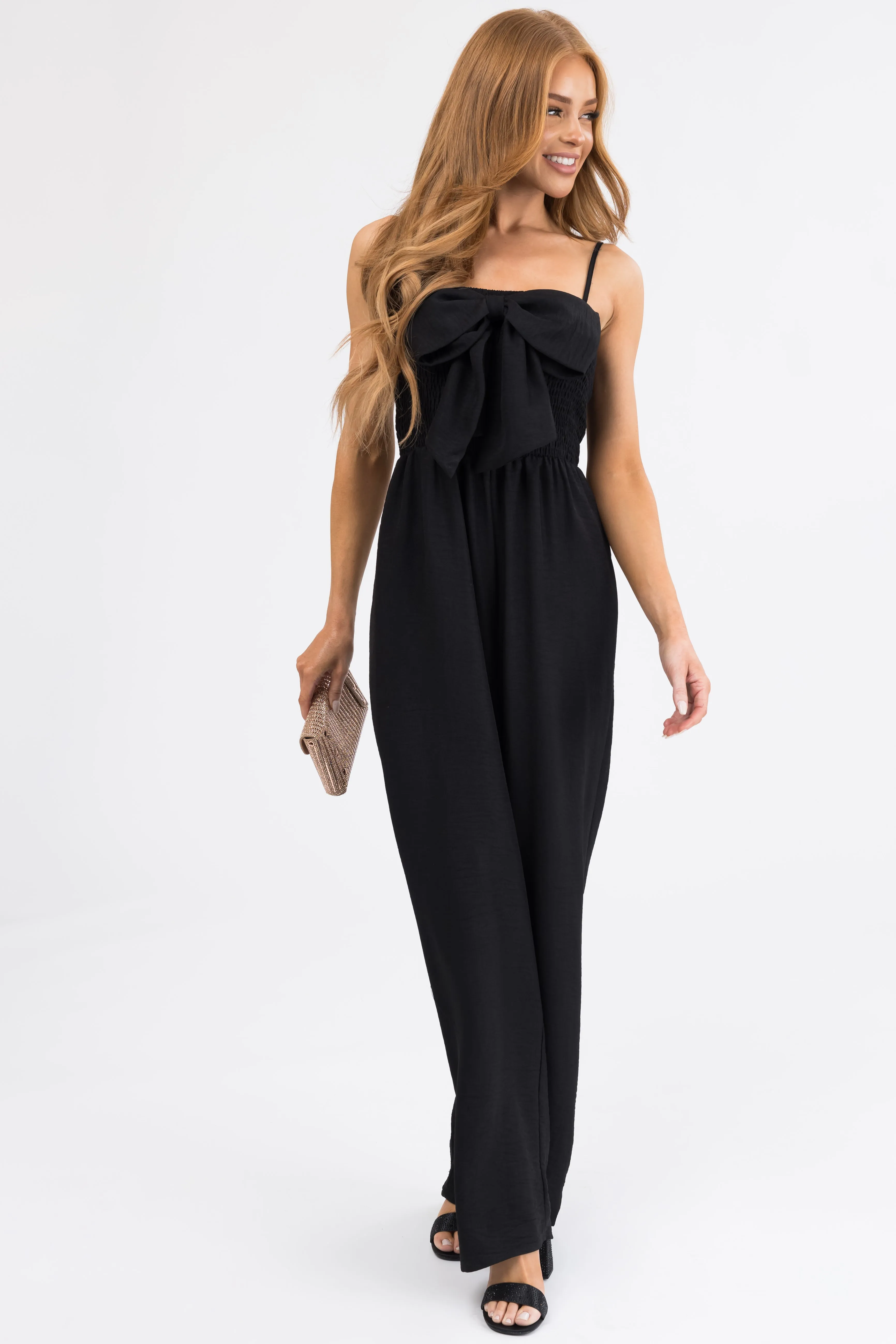 Black Bow Front Smocked Jumpsuit sold by Lime Lush