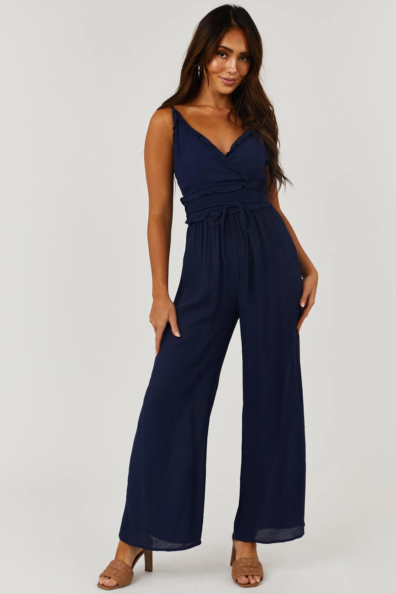 Navy Sleeveless V Neck Smocked Waist Jumpsuit sold by Lime Lush