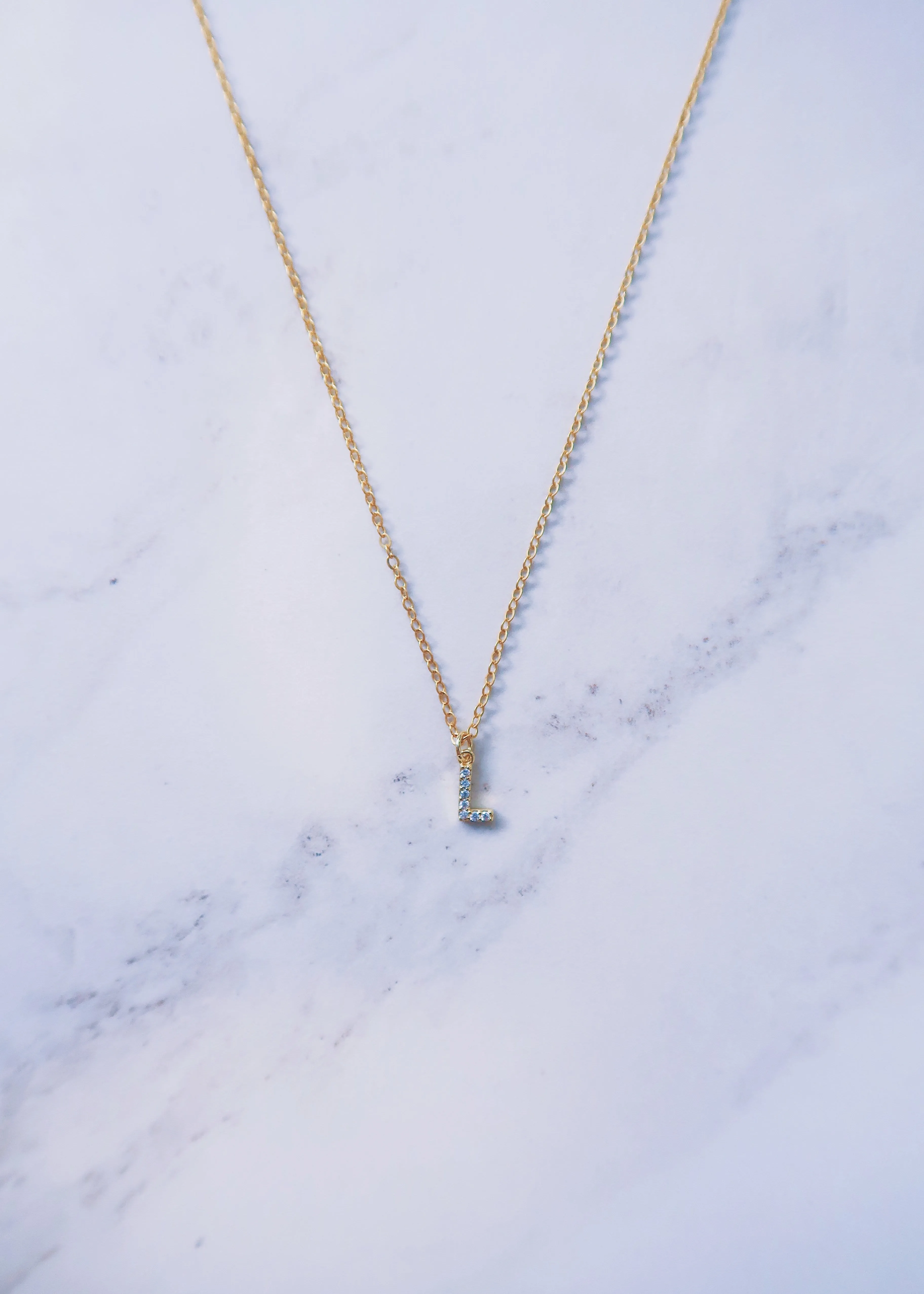 Tiny Crystal Initial Necklace sold by Ten Wilde