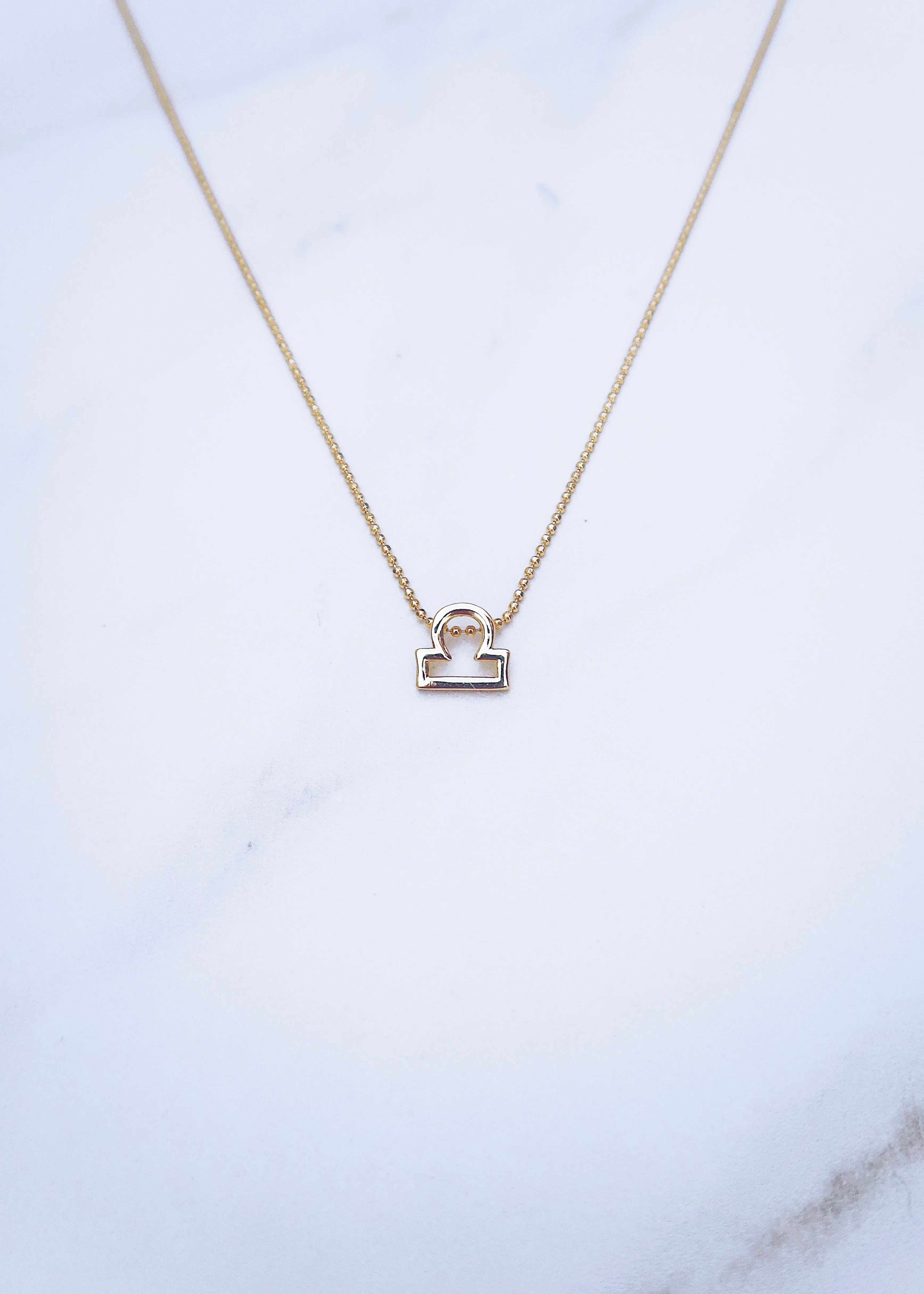 Libra Zodiac Necklace sold by Ten Wilde
