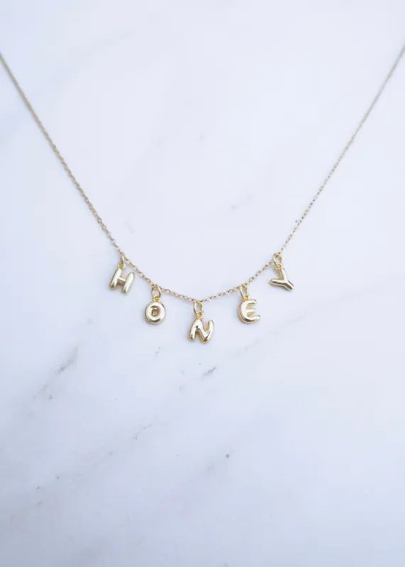 Gold Bubble Name Necklace sold by Ten Wilde