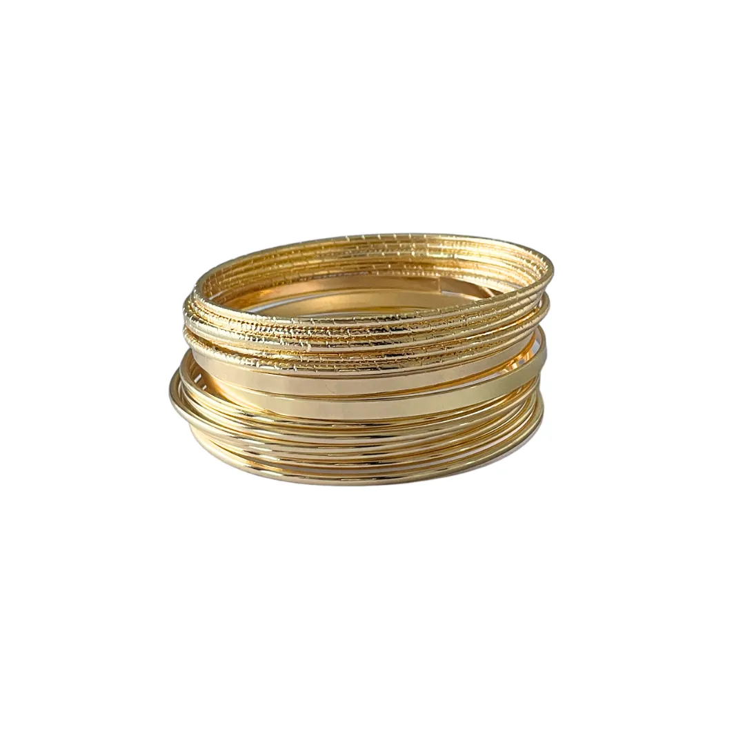 Gold Bangles sold by Ten Wilde