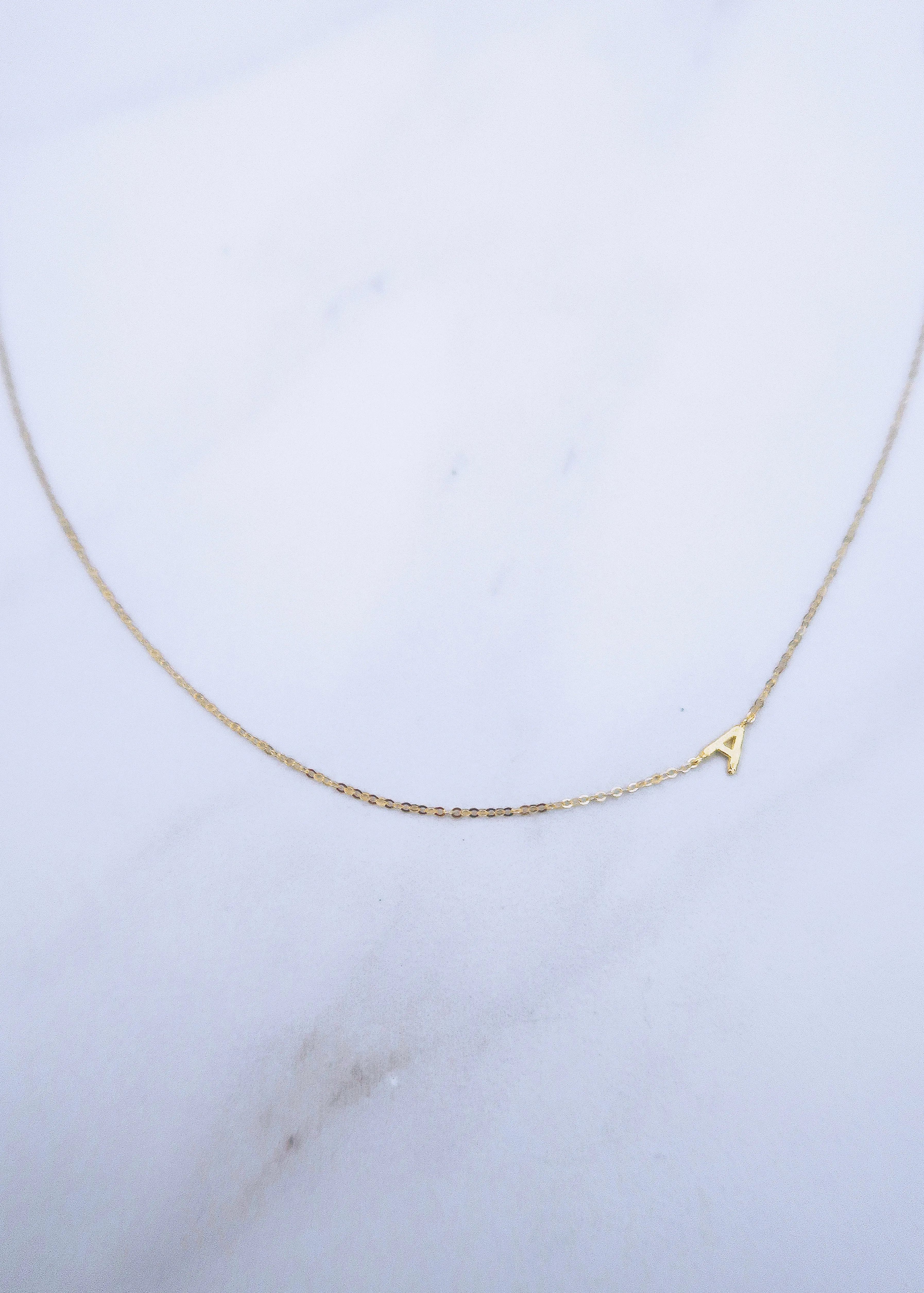 Sideways Initial Necklace sold by Ten Wilde