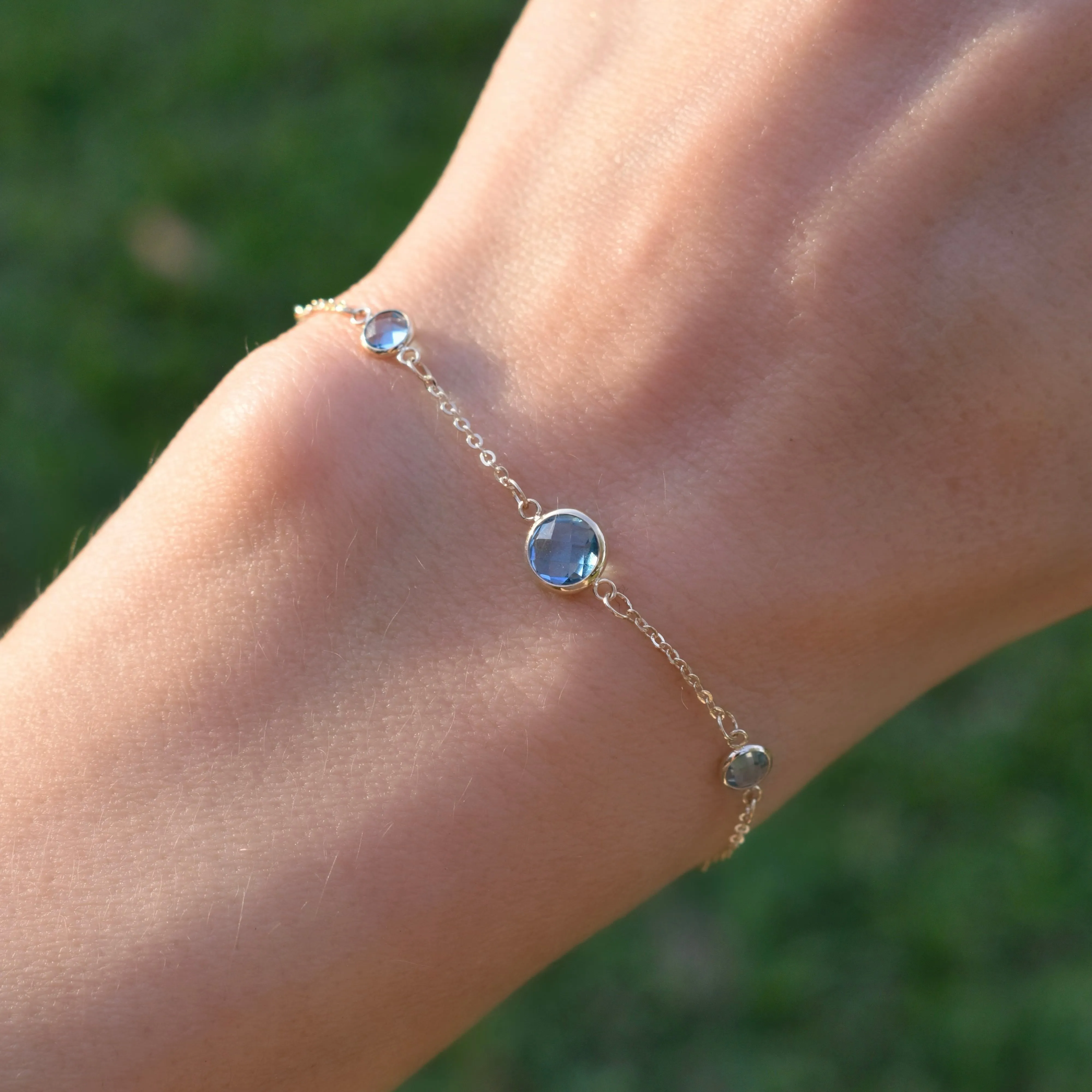 1 Grand & 4 Petite Nantucket Blue Topaz Bracelet in 14k Gold (December) sold by Haverhill product image thumbnail 3