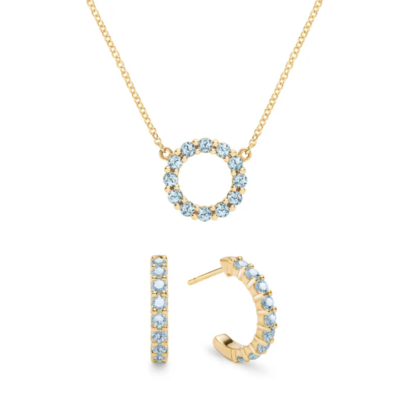 Rosecliff Small Circle Nantucket Blue Topaz Necklace and Huggie Hoop Earrings Set in 14k Gold (December) sold by Haverhill