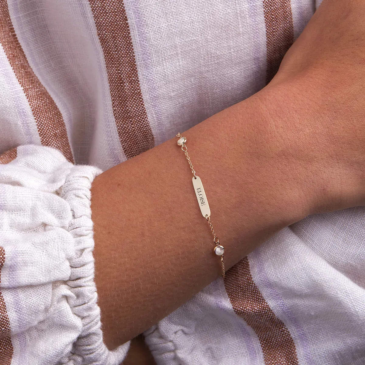 1 Nameplate & 6 Petite White Topaz Bracelet in 14k Gold (April) sold by Haverhill product image thumbnail 3