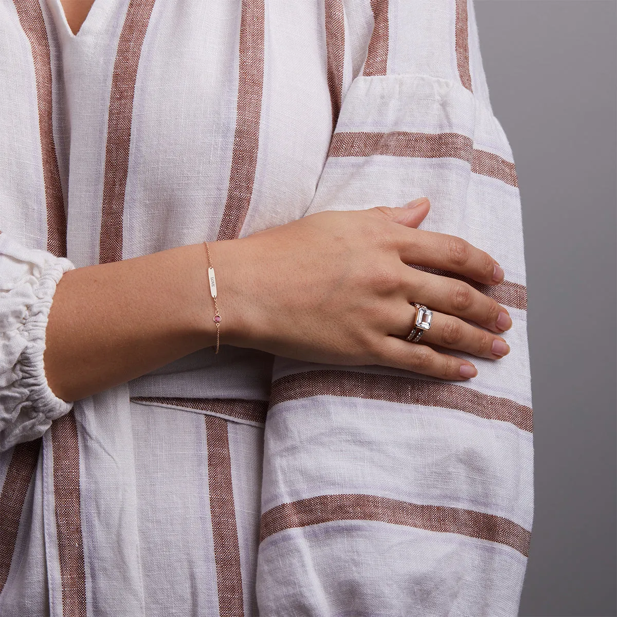 Pink Awareness LOVE & 1 Petite Pink Sapphire Bracelet in 14k Gold sold by Haverhill product image thumbnail 2