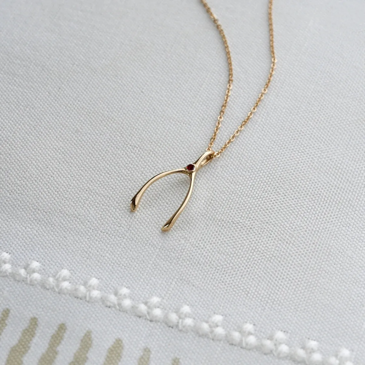 Small Garnet Wishbone Pendant in Solid 14k Gold (January) sold by Haverhill product image thumbnail 3