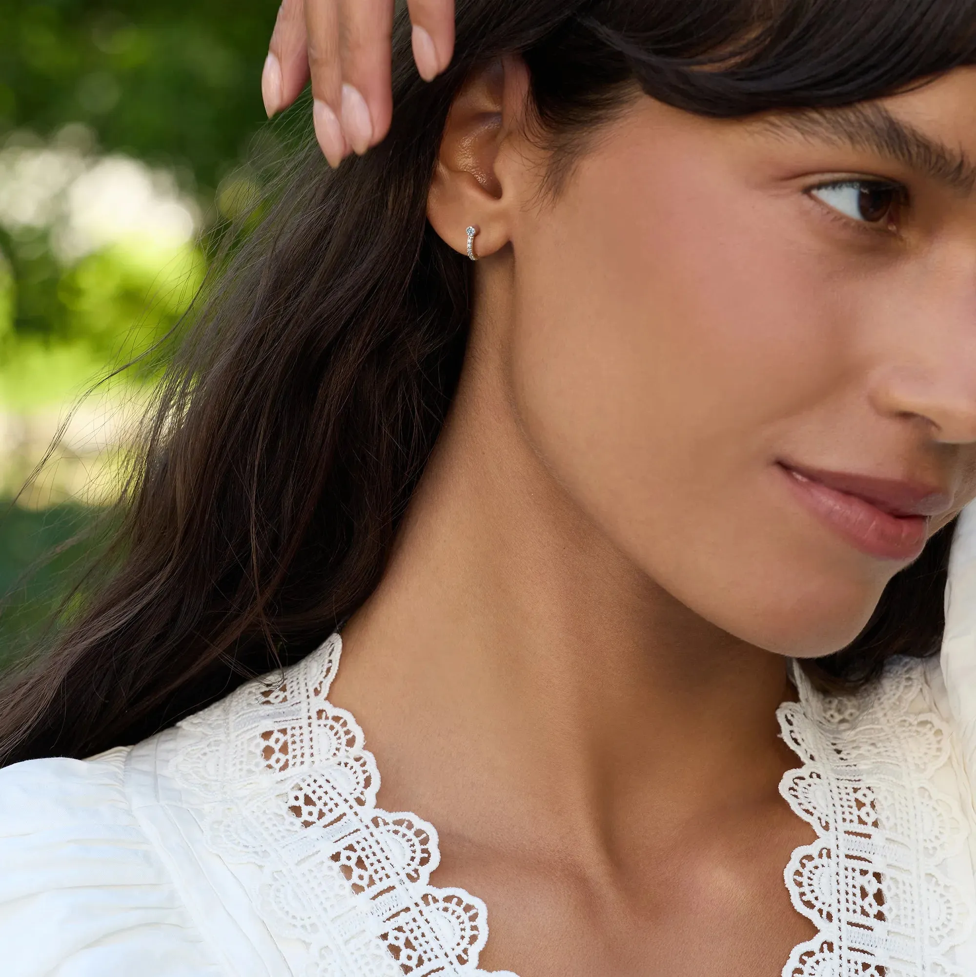 Tiny Diamond Huggie Hoops in 14k Gold (April) sold by Haverhill product image thumbnail 2