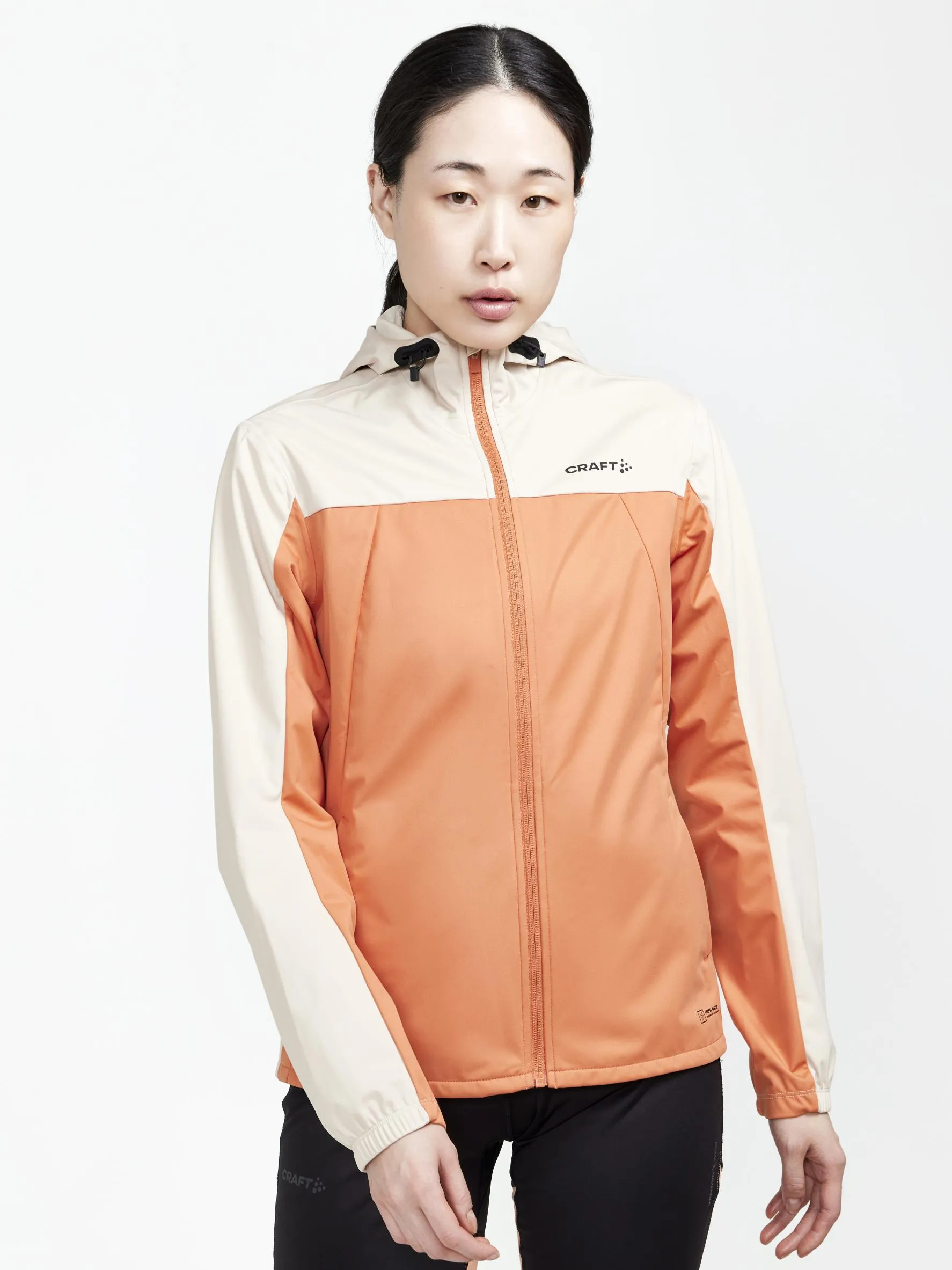 WOMEN'S ADV ESSENCE HYDRO JACKET - RUSTY GLOW-ECRU sold by Craft Sportswear