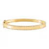 Diamond Pavé X Solid Bangle 14K sold by Adina Eden's