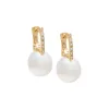 Diamond X Pearl Huggie Earring 14K sold by Adina Eden's