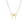 Pearl X Solid Bow Tie Necklace sold by Adina Eden's