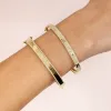 Diamond Baguette X Pavé Bangle 14K sold by Adina Eden's