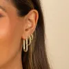 Wide Solid Ridged Oval Shape Huggie Earring sold by Adina Eden's