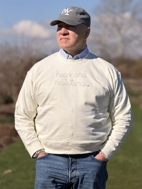 "hugs and resistance" Men's Sweatshirt made by Lingua Franca NYC