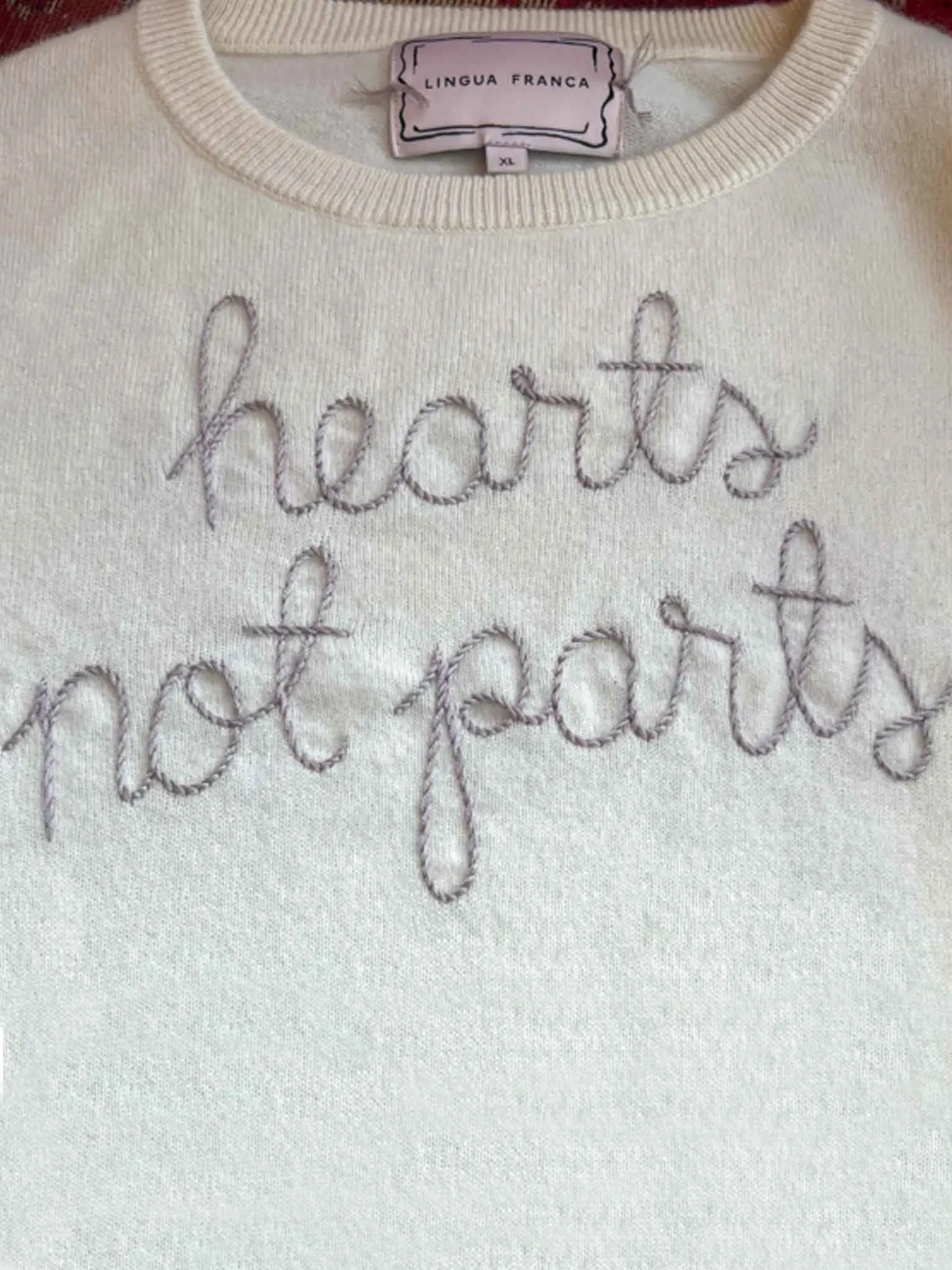 "hearts not parts" Crewneck sold by Lingua Franca NYC
