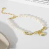 Gold Heart Charm Pearl Bracelet sold by Mason & Madison Co.