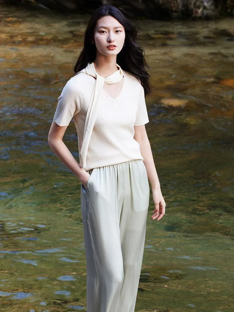 White Acetate V-neck Knit Top sold by Goelia