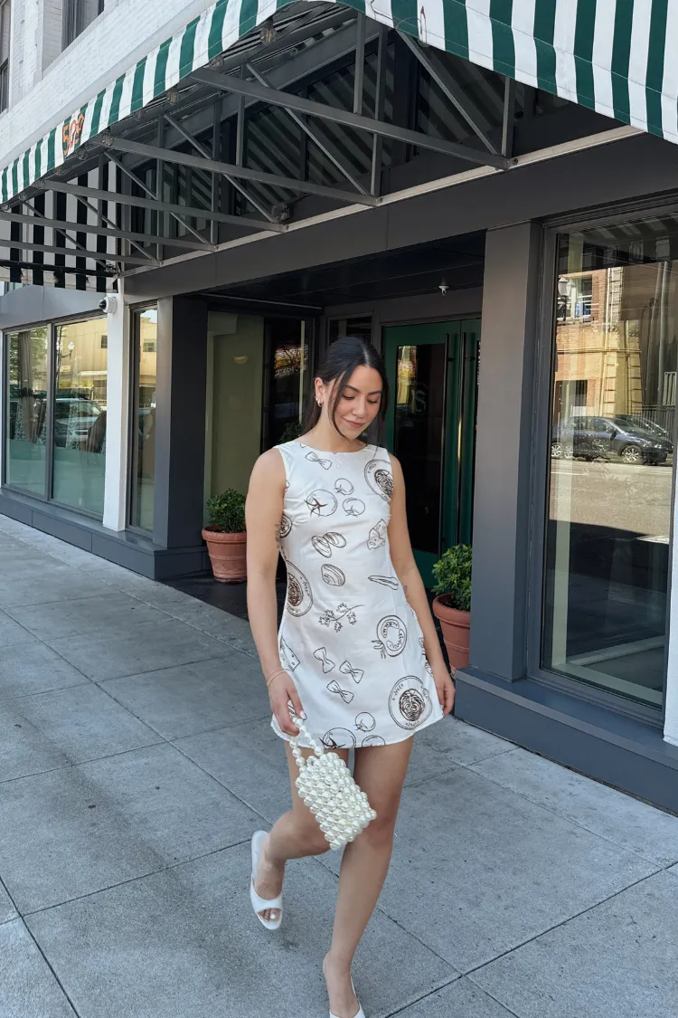 Italian Dreams Satin Sleeveless Mini Dress - Cream sold by Confête