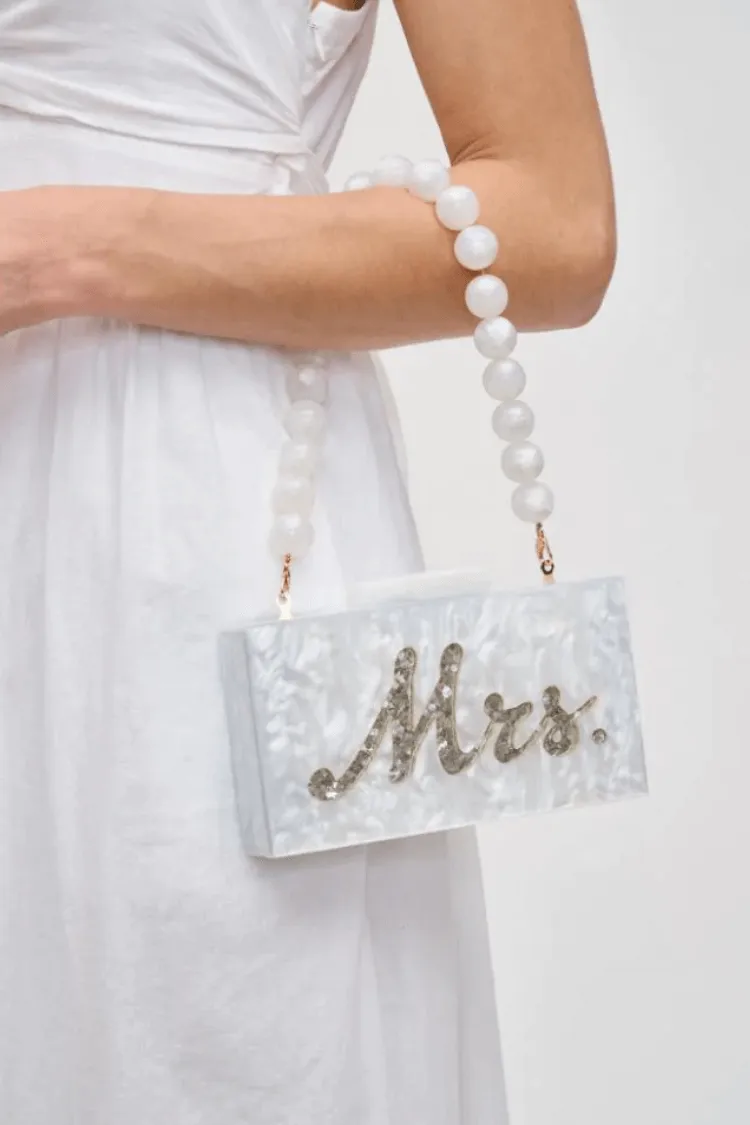Lotus Mrs. Acrylic Clutch sold by Confête