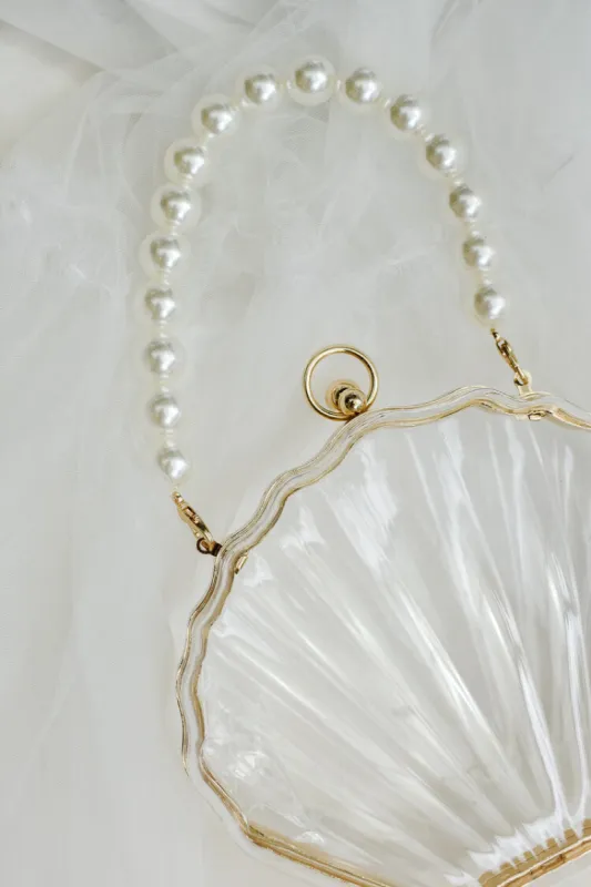 Acrylic Shell Bag with Pearl Handle sold by Confête