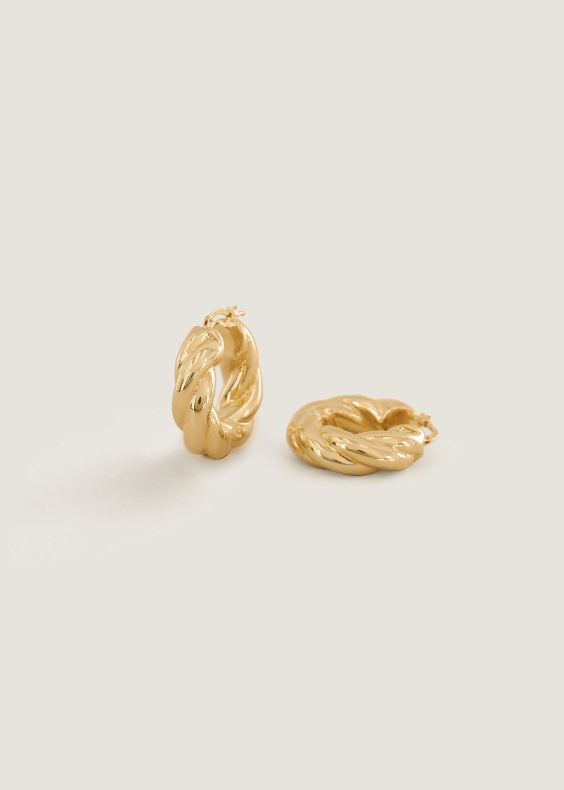 Taylor Twist Hoop Earrings sold by Kinn
